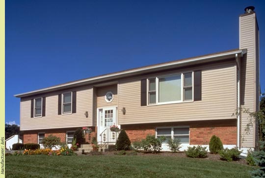 The recessed entry, cantilevered front, and brick kneewall make this a classic American raised ranch - Manufacturer:  Avis