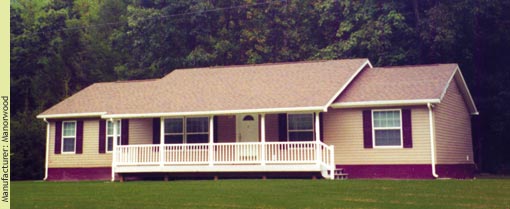 The strong vertical lines of the front porch make this straight ranch proud - Manufacturer:  Manorwood